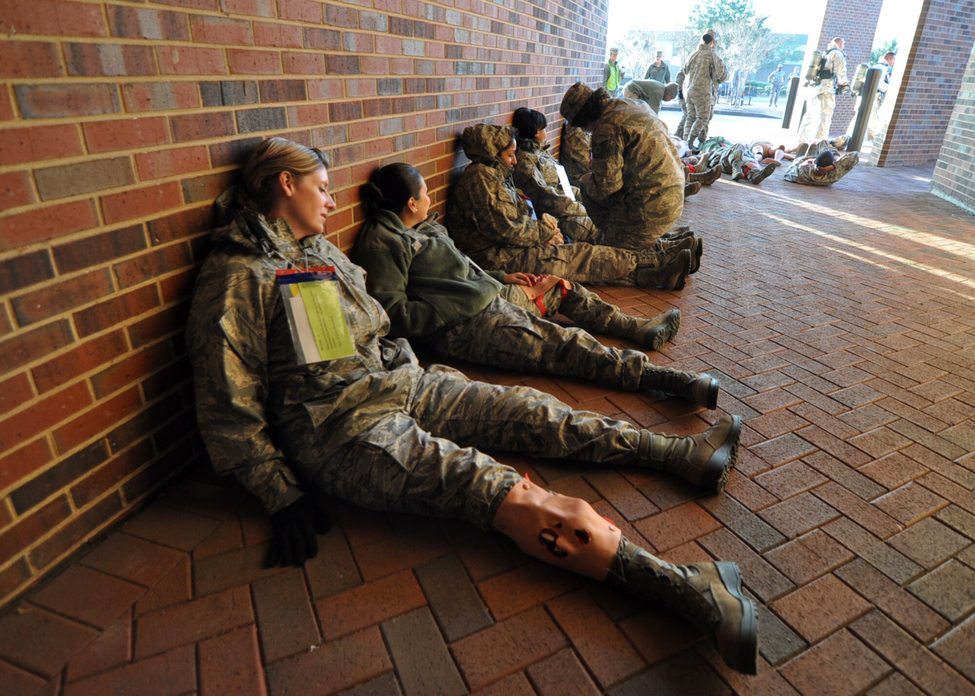 Airmen from the 315th Airlift Wing at Joint Base Charleston, S.C. are being triaged outside the medical clinic Jan. 28, 2013. The 315th Aerospace Medicine Squadron conducted a mass casualty exercise and more than 145 Airmen from the 315th Airlift Wing participated in the event. Firefighters, civil engineers, members of the clinic, and aeromedical evacuation personnel all played crucial roles in the success of the exercise. (U.S. Air Force photo/Staff Sgt. Shane Ellis)