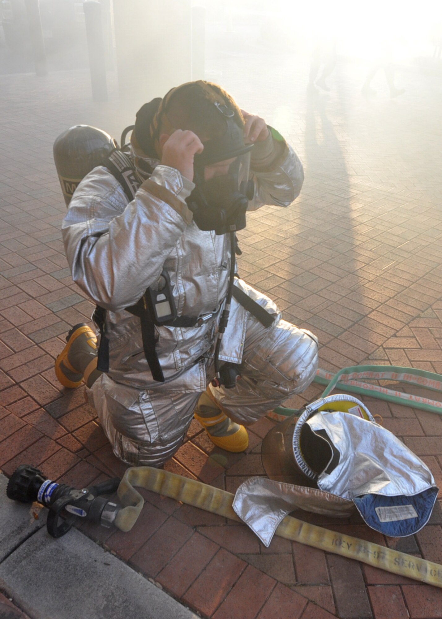 A firefighter prepares to enter the medical clinic Jan. 28, 2013 at Joint Base Charleston, S.C. The 315th Aerospace Medicine Squadron conducted a mass casualty exercise, and firefighters from the 315th Airlift Wing were first to respond during the event. More than 145 Airmen from the 315 AW contributed to the success of the exercise. (U.S. Air Force photo/Staff Sgt. Shane Ellis)