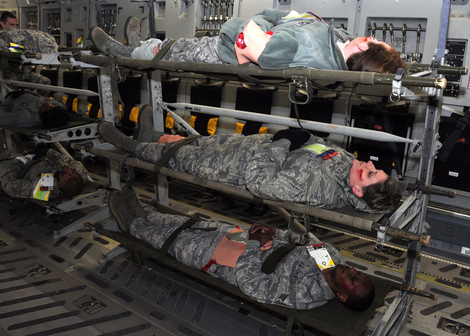 Patients rest on liters onboard a C-17 Globemaster III Jan. 28, 2013 at Joint Base Charleston, S.C. The patients were part of a mass casualty exercise which included more than 145 Airmen from the 315th Airlift Wing. Firefighters, civil engineers, members of the clinic, and aeromedical evacuation personnel all played crucial roles in the success of the exercise. (U.S. Air Force photo/Staff Sgt. Shane Ellis)