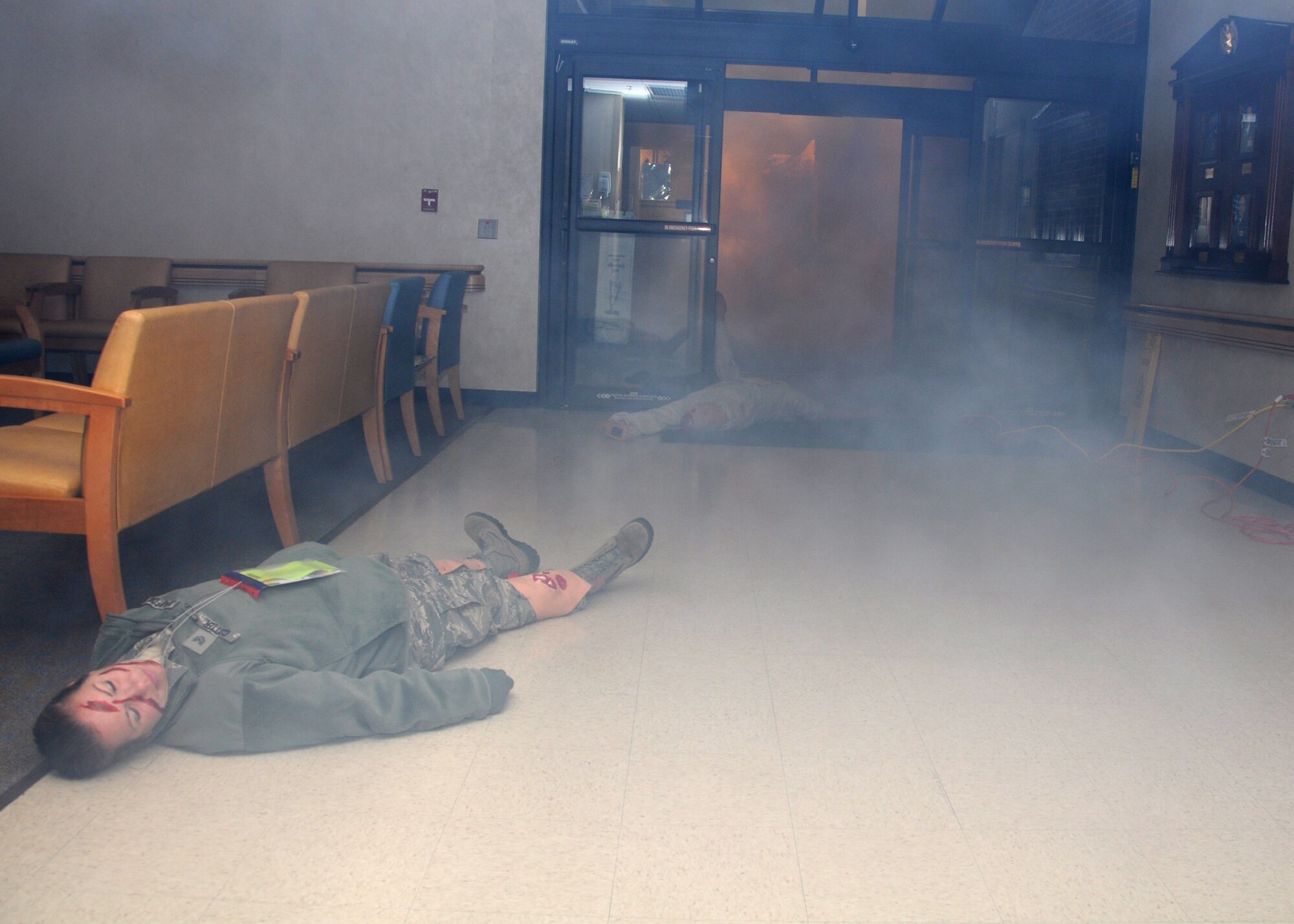 Smoke fills the entry way of the medical clinic Jan. 28, 2013 at Joint Base Charleston, S.C. The 315th Aerospace Medicine Squadron conducted a mass casualty exercise, and more than 145 Airmen from the 315th Airlift Wing participated in the event. The smoke resulted after a lone gunman set off a simulated bomb outside the clinic. Firefighters, civil engineers, members of the clinic, and aeromedical evacuation personnel all played crucial roles in the success of the exercise. (U.S. Air Force photo/Staff Sgt. Shane Ellis)