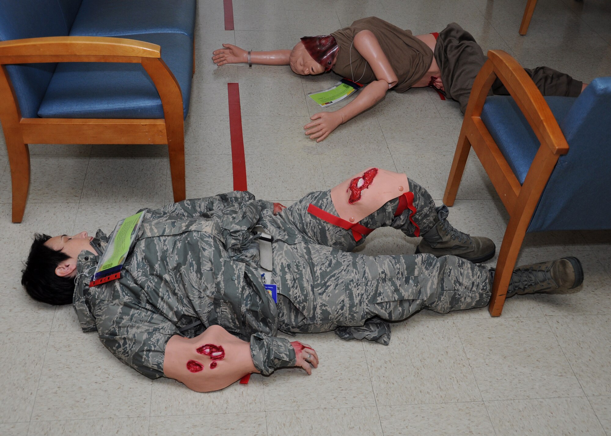 Injured patients wait for first responders Jan. 28, 2013 inside the medical clinic at Joint Base Charleston, S.C. The 315th Aerospace Medicine Squadron conducted a mass casualty exercise, and more than 145 Airmen from the 315th Airlift wing participated in the event. Firefighters, civil engineers, members of the clinic, and aeromedical evacuation personnel all played crucial roles in the success of the exercise. (U.S. Air Force photo/Staff Sgt. Shane Ellis)