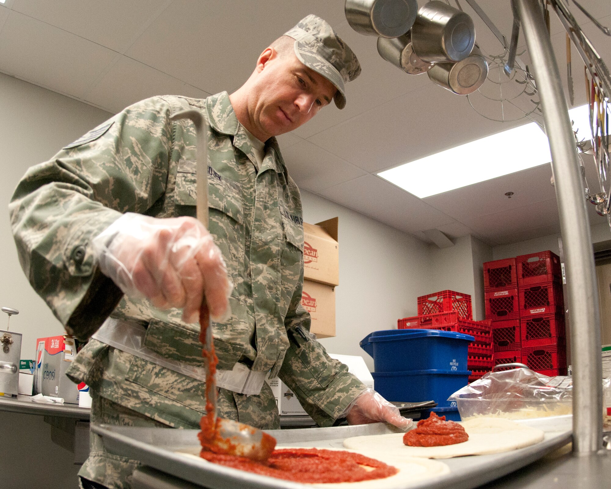 Tech. Sgt. Robert Rojek prepares a pizza for the afternoon meal, Pease Air National Guard Base, N.H., February 3, 2013.  (National Guard photo by Staff Sgt. Curtis J. Lenz/Released)