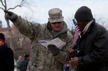 Senior Master Sgt. Daryl Ferricks, 171st Air Refueling Wing, Pennsylvania Air National Guard, provides directions to a 57th Presidential Inauguration attendee in Washington, D.C., Jan. 21, 2013. More than 6,000 Soldiers and Airmen were sworn in as special police to help local and federal law enforcement with traffic and crowd control throughout the 2013 Presidential Inauguration. (Air National Guard photo by Senior Airman Andrea F. Liechti)