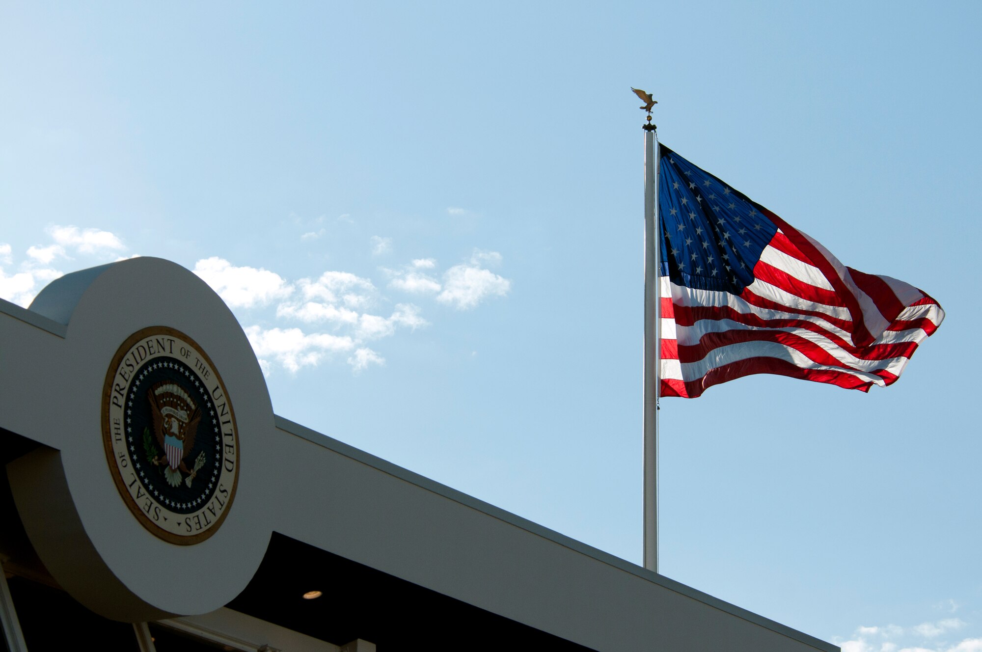 An American flag flies above the President's reviewing stand during the 57th Presidential Inauguration parade in Washington, D.C., Jan. 21, 2013. National Guardsmen joined forces with local and federal law enforcement to ensure the parade route was kept clear for the President. (Air National Guard photo by Senior Airman Andrea F. Liechti)
