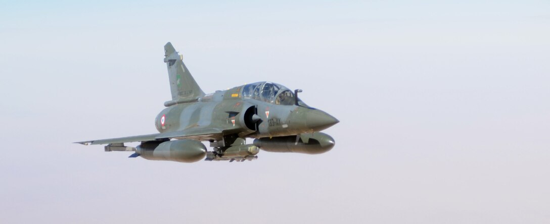 A French air force Mirage 2000 flies behind a U.S. Air Force KC-135 Stratotanker over Africa Feb. 2, 2013. Tanker crews from the 100th Air Refueling Wing, RAF Mildenhall, England, began conducting refueling missions in support of French operations in Mali from a deployed location in southwest Europe Jan 27. (U.S. Air Force photo by Staff Sgt. Austin M. May/Released)