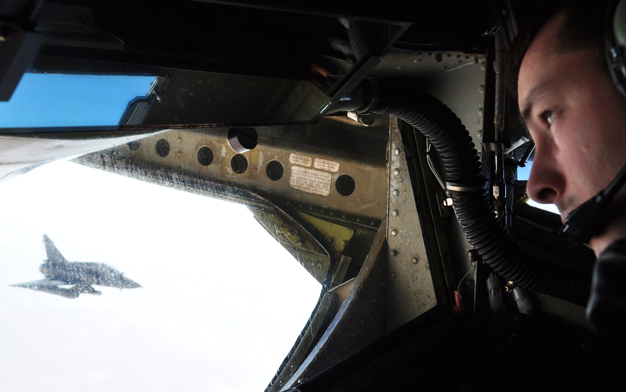 Staff Sgt. Andrew Valence, boom operator deployed with a detachment from the 100th Air Refueling Wing, RAF Mildenhall, Enlgand, prepares to fuel a French Mirage fighter over Africa Jan. 29, 2013. Tankers from RAF Mildenhall, operating from a forward deployed location, began flying refueling missions in support of French operations in Mali Jan. 27, 2013. (U.S. Air Force photo by Capt. Jason Smith