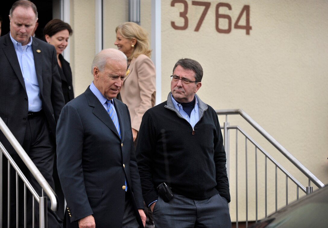 U.S. Deputy Defense Secretary Ashton B. Carter listens as he and U.S. Vice President Joe Biden converse after visiting wounded warriors at Landstuhl Regional Medical Center in Landstuhl, Germany, Feb. 3, 2013. 