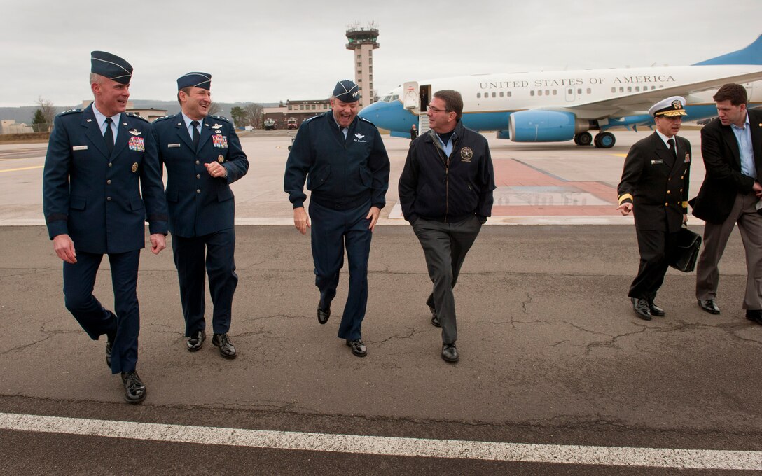 U.S. Deputy Defense Secretary Ashton B. Carter enjoys a light moment as he walks with U.S. Air Force Gen. Philip M. Breedlove, commander of U.S. Air Forces in Europe, after landing on Ramstein Air Base, Germany, Feb. 3, 2013.