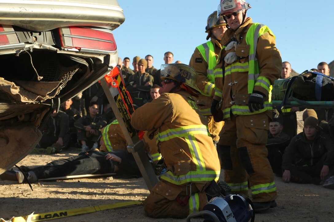 Combat Center firefighters treat the simulated crash site as they would a real crash, going through all the appropriate steps to analyze the wreckage and help any casualties inside. Combat Center Fire was on hand, helping the battalion illustrate the dangers of unsafe driving.