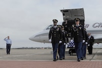 The remains of Sgt. Mark Schoonhoven were transported through Joint Base San Antonio-Randolph Feb. 4.  JBSA-Randolph?s Harmon drive was lined with Randolph employees and family members paying final tribute to Schoonhoven as his remains were transported back to Michigan.  Schoonhoven was assigned to the 32nd Transportation Company, 157th Combat Sustainment Support Battalion. He died Jan. 20 from injuries sustained from an improvised explosive device while serving in Afghanistan.  (U. S. Air Force photo by Don Lindsey)