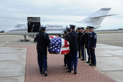 The remains of Sgt. Mark Schoonhoven were transported through Joint Base San Antonio-Randolph Feb. 4.  JBSA-Randolph?s Harmon drive was lined with Randolph employees and family members paying final tribute to Schoonhoven as his remains were transported back to Michigan.  Schoonhoven was assigned to the 32nd Transportation Company, 157th Combat Sustainment Support Battalion. He died Jan. 20 from injuries sustained from an improvised explosive device while serving in Afghanistan.  (U. S. Air Force photo by Don Lindsey)