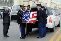 The remains of Sgt. Mark Schoonhoven were transported through Joint Base San Antonio-Randolph Feb. 4.  JBSA-Randolph?s Harmon drive was lined with Randolph employees and family members paying final tribute to Schoonhoven as his remains were transported back to Michigan.  Schoonhoven was assigned to the 32nd Transportation Company, 157th Combat Sustainment Support Battalion. He died Jan. 20 from injuries sustained from an improvised explosive device while serving in Afghanistan.  (U. S. Air Force photo by Don Lindsey)