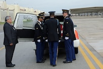 The remains of Sgt. Mark Schoonhoven were transported through Joint Base San Antonio-Randolph Feb. 4.  JBSA-Randolph?s Harmon drive was lined with Randolph employees and family members paying final tribute to Schoonhoven as his remains were transported back to Michigan.  Schoonhoven was assigned to the 32nd Transportation Company, 157th Combat Sustainment Support Battalion. He died Jan. 20 from injuries sustained from an improvised explosive device while serving in Afghanistan.  (U. S. Air Force photo by Don Lindsey)