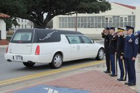 The remains of Sgt. Mark Schoonhoven were transported through Joint Base San Antonio-Randolph Feb. 4.  JBSA-Randolph?s Harmon drive was lined with Randolph employees and family members paying final tribute to Schoonhoven as his remains were transported back to Michigan.  Schoonhoven was assigned to the 32nd Transportation Company, 157th Combat Sustainment Support Battalion. He died Jan. 20 from injuries sustained from an improvised explosive device while serving in Afghanistan.  (U. S. Air Force photo by Don Lindsey)