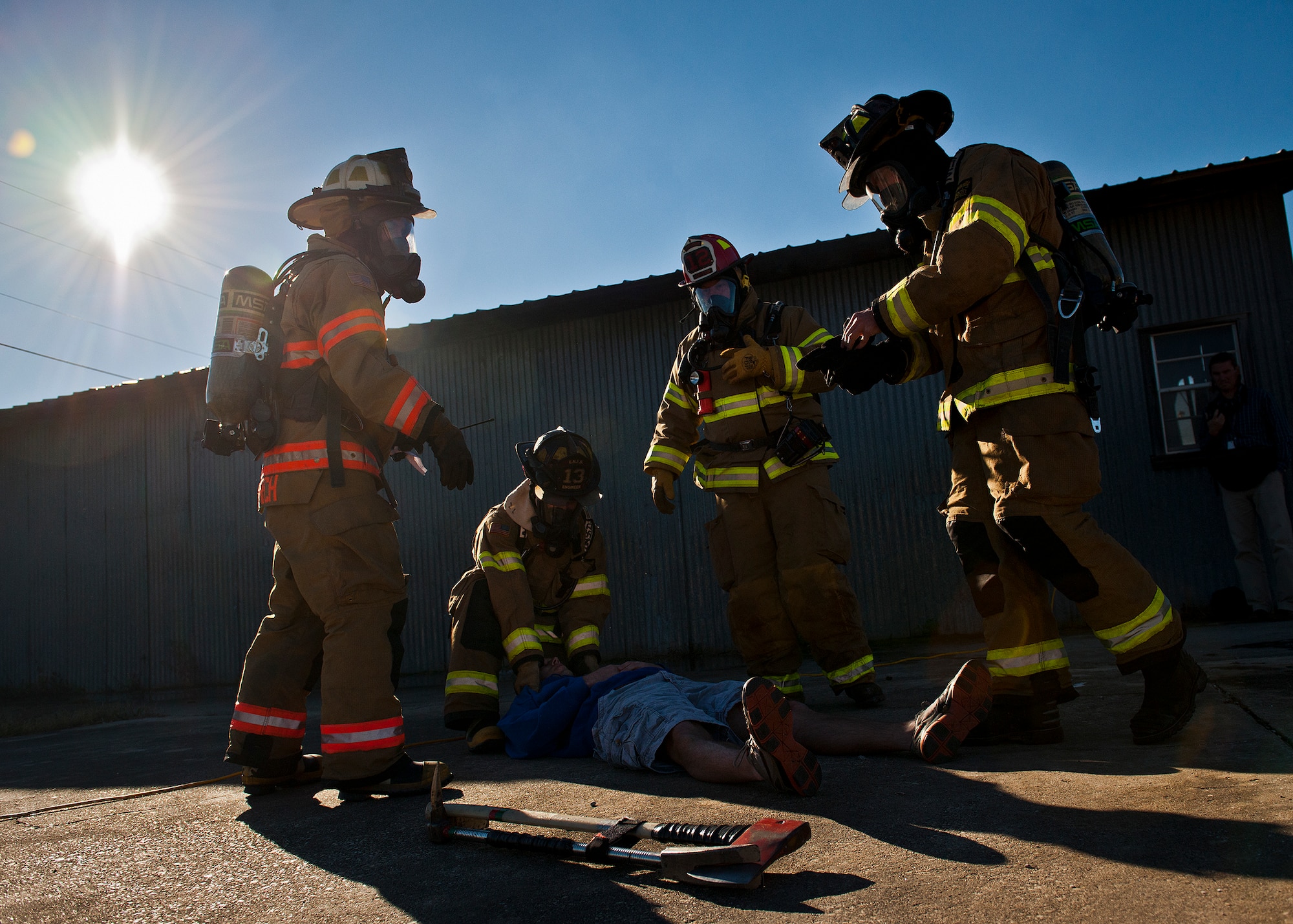 Valparaiso firefighters prepare to move a simulated victim during a joint major accident response exercise between Eglin Air Force Base and the city Jan. 31.  Emergency responders from the base and the city were called to a downed aircraft scenario featuring fire, wreckage and victims with multiple injuries.  The responders had to work as a team and coordinate movements at the simulated crash site, put out fires and attend to the wounded victims.  (U.S. Air Force photo/Samuel King Jr.)