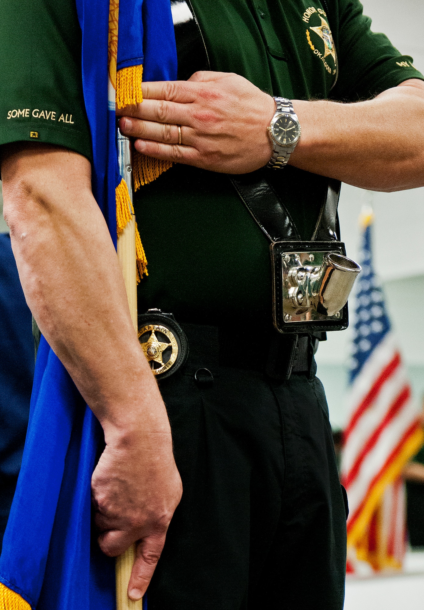 Capt. Kenneth LaPee, of the Okaloosa County Sheriff’s Office Honor Guard, practices proper form while holding a flag during a training session at Eglin Air Force Base, Fla., Feb. 1.  The OCSO team came together with Eglin’s honor guard to learn military protocols used during various ceremonies such as retirements, funerals, etc.  During this first training session Eglin’s Airmen taught them proper movements while carrying flags and rifles.  This was the first of many proposed training sessions between the two teams.  (U.S. Air Force photo/Samuel King Jr.)