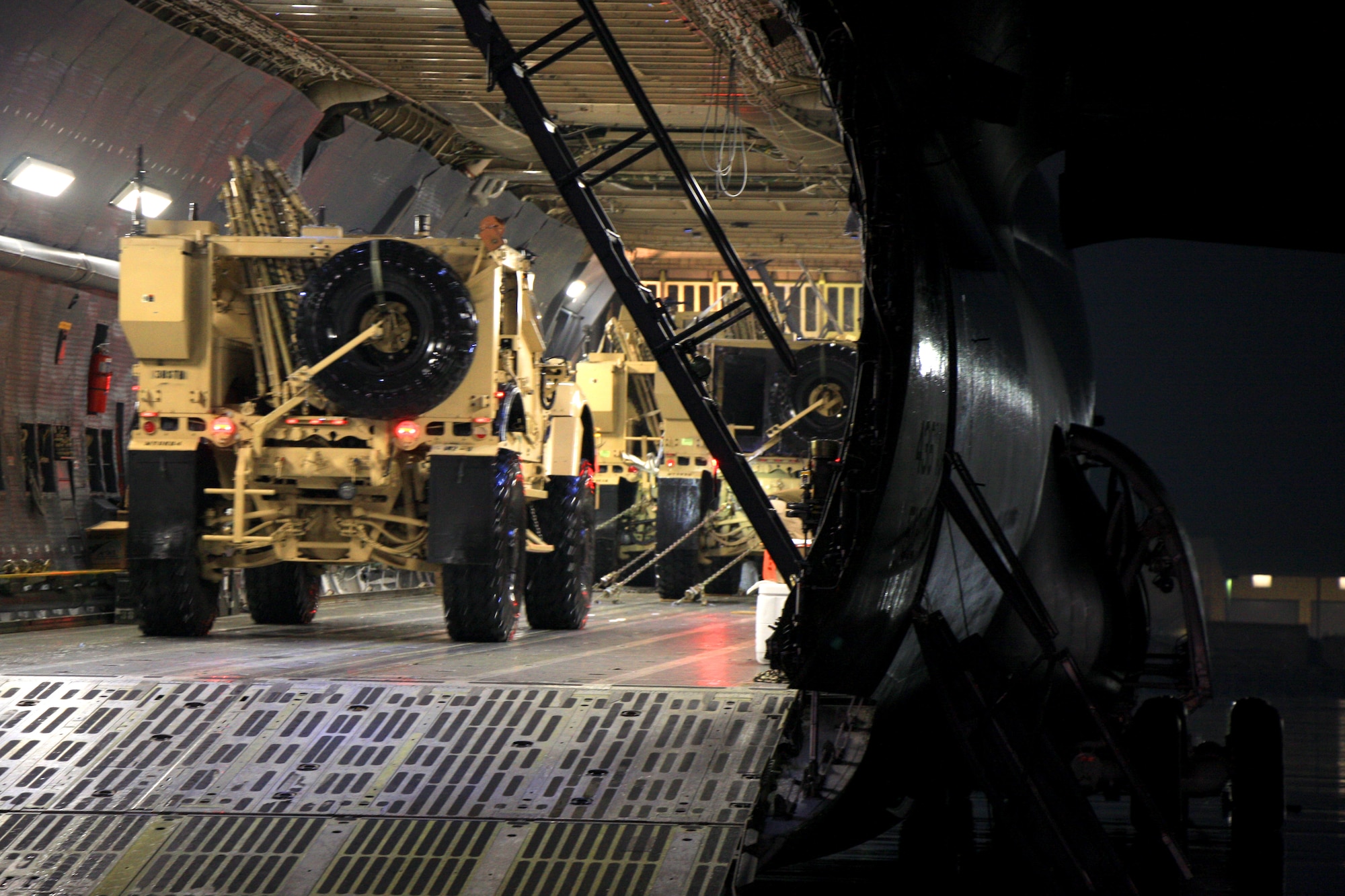 An Oshkosh M-ATV Mine Resistant, Ambush Protected vehicle, or MRAP, drives onto a C-5M Super Galaxy to be chained down and flown out. The C-5M Super Galaxy has served the U.S. Air Force since 1969, and continues to provide vital heavy air lift to troops worldwide. (U.S. Army photo/1st Lt. Henry Chan, 18th Combat Sustainment Support Battalion Public Affairs)