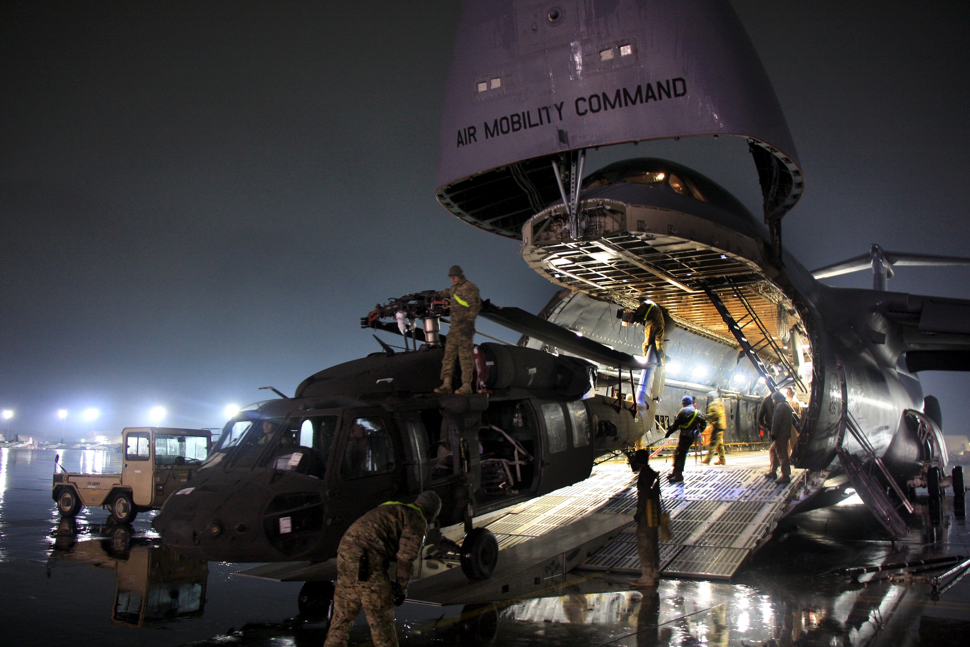 Soldiers and Airmen offload a UH-64 Black Hawk helicopter from a C-5M Super Galaxy at Bagram Air Field. The C-5M Super Galaxy has served the U.S. Air Force since 1969, and continues to provide vital heavy air lift to troops worldwide. (U.S. Army photo/1st Lt. Henry Chan, 18th Combat Sustainment Support Battalion Public Affairs)