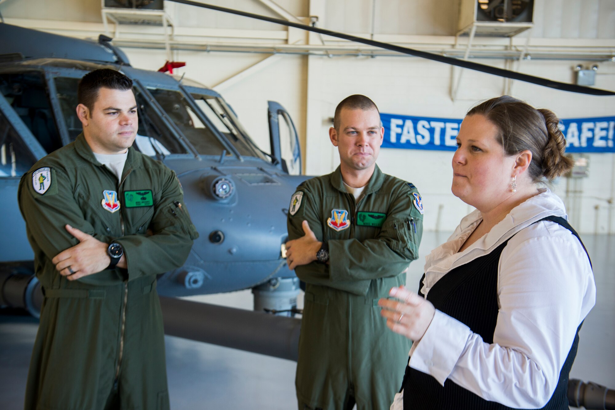 Merritt Myers, district director for Georgia Congressman Jack Kingston, speaks with U.S. Air Force Staff Sgt. Michael Brooks, 41st Rescue Squadron flight engineer, left, and Capt. Michael Welt, 41st RQS HH-60 pilot, during a visit to Moody Air Force Base, Ga., Jan. 31, 2013. Ten staff delegates visited to meet Airmen and witness what Moody brings to the fight and local community. (U.S. Air Force photo by Staff Sgt. Jamal D. Sutter/Released) 