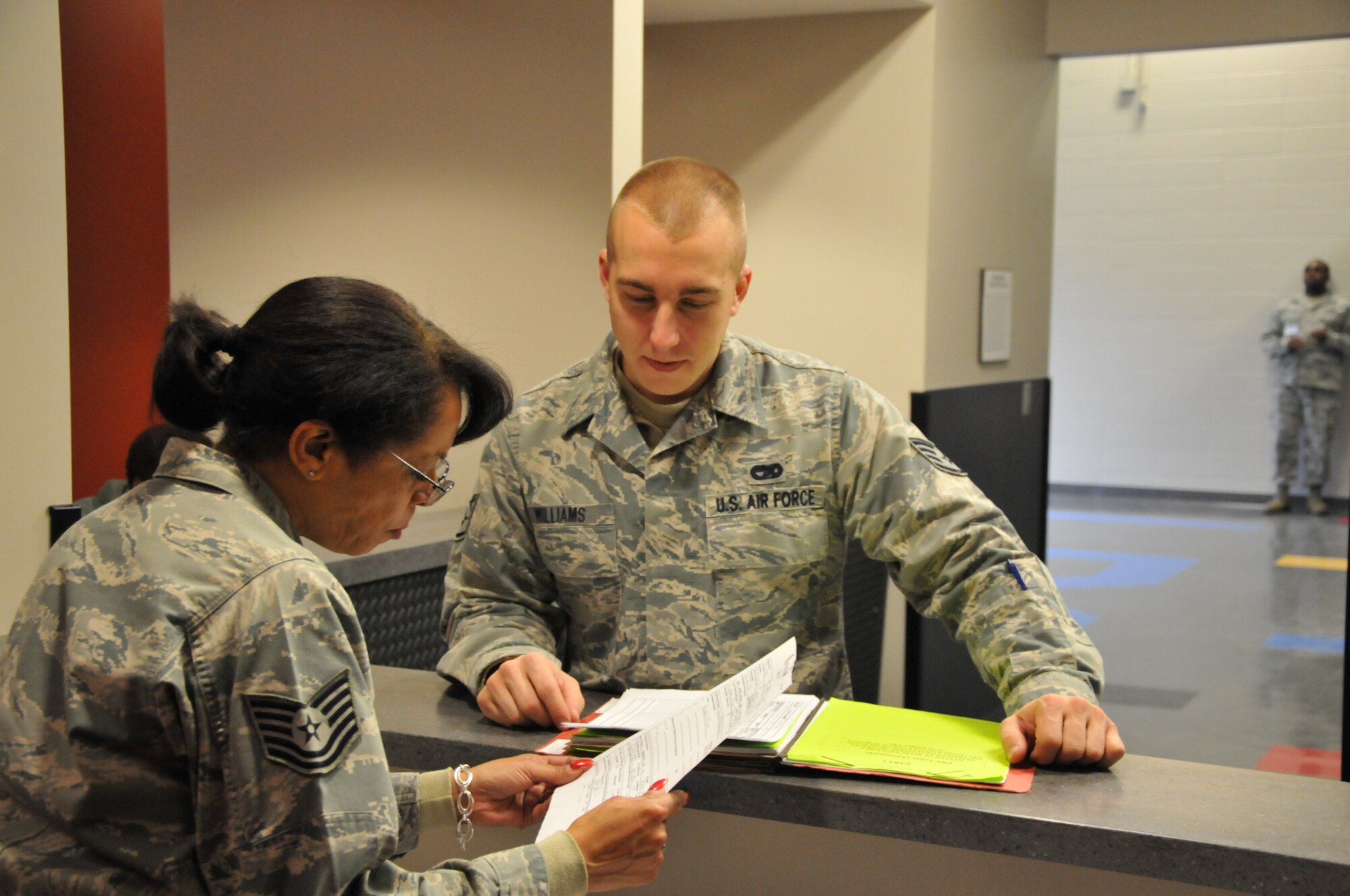 Tech. Sgt. Cynthia Owens, of the 94th Airlift Wing Airman and Family Readiness Office, briefs members of the 94th AW during phase one of preparation for an upcoming operational readiness exercise on Jan. 6 here. This phase, the first of three, required participating Airmen to inventory and prepare equipment for shipment for a mock deployment and go through a deployment line in building 819 – recently renovated to accommodate an increased operational tempo. (U.S. Air Force photo/Senior Airman Elizabeth Van Patten)