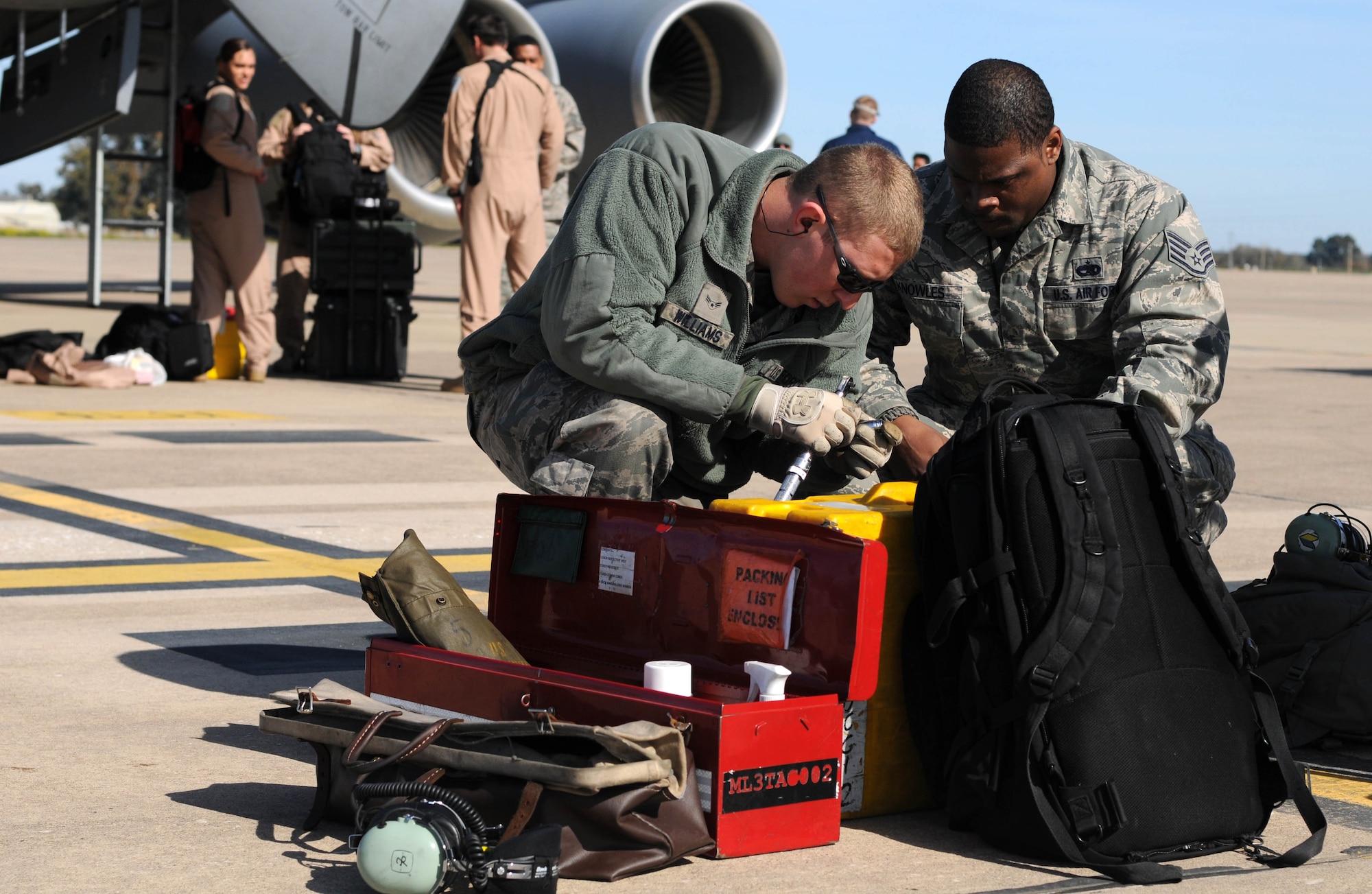 Airman 1st Class Colton Williams (left) and Staff Sgt. Tremain Knowles, KC-135 maintainers from the 100th Aircraft Maintenance Squadron, RAF Mildenhall, England, complete post-flight recovery procedures on a jet after a mission over Africa Feb. 3, 2013. Airmen from RAF Mildenhall deployed to southwest Europe in January to support French operations in Mali. (U.S. Air Force photo by Staff Sgt. Austin M. May)