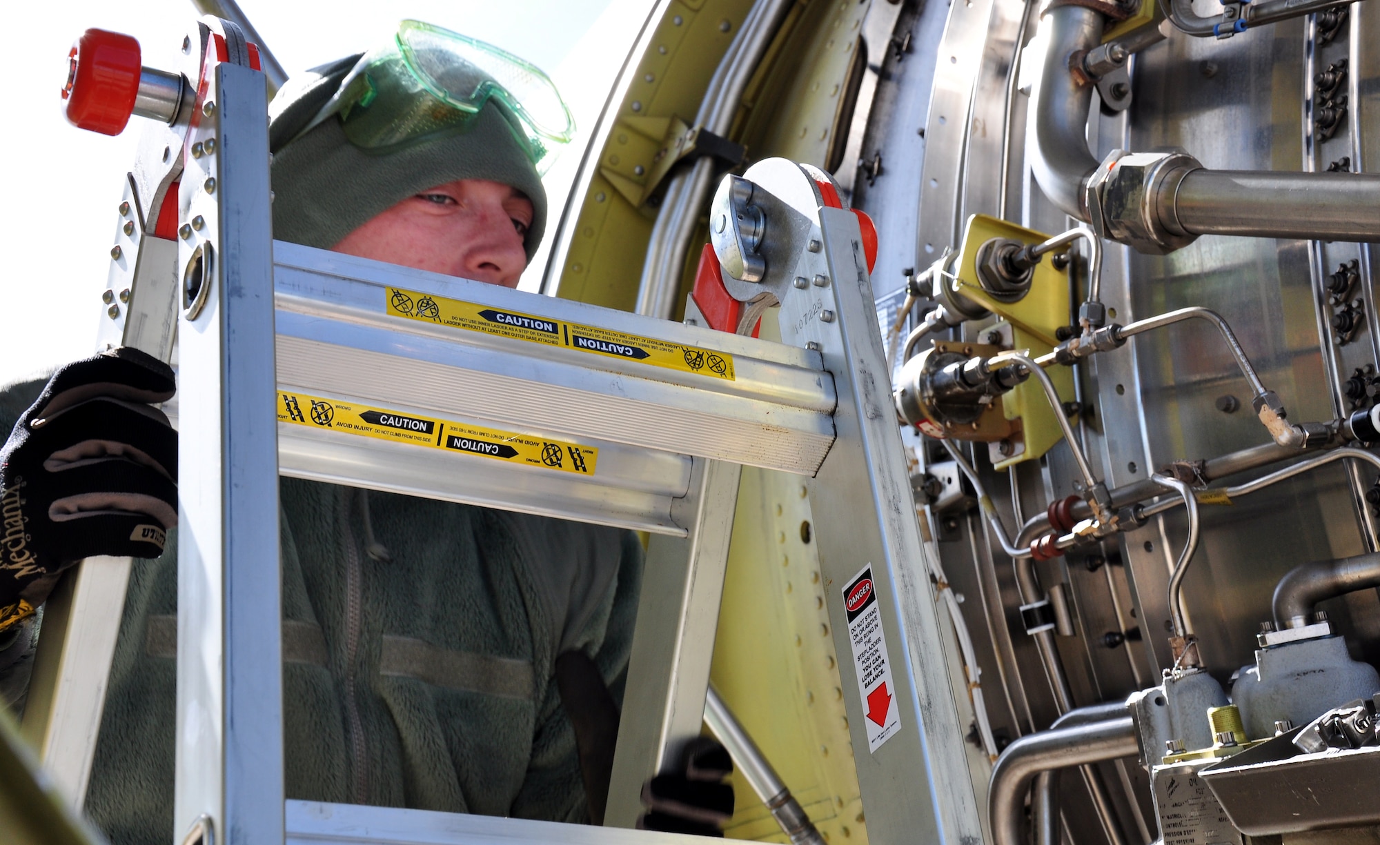 Senior Airman Daniel Perian, 351st Expeditionary Air Refueling Squadron maintainer and Etowah, Tenn., native, looks into an engine of a KC-135 Stratotanker Feb. 3, 2013. Members of the 351st EARS, from the 100th Air Refueling Wing, RAF Mildenhall, England, are deployed to a forward operating location in southwest Europe. The group deployed on Jan. 26 and began conducting aerial refueling missions on Jan. 27 to support French operations in Mali. (U.S. Air Force photo by Capt. Jason Smith/Released)