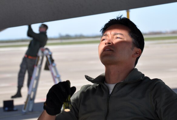 Tech. Sgt. Eugene Marques, 351st Expeditionary Air Refueling Squadron maintainer, looks into an engine of a KC-135 Stratotanker Feb. 3, 2013. Marques is a Guam native. Members of the 351st EARS, from the 100th Air Refueling Wing, RAF Mildenhall, England, are deployed to a forward operating location in southwest Europe. The group deployed on Jan. 26 and began conducting aerial refueling missions on Jan. 27 to support French operations in Mali. (U.S. Air Force photo by Capt. Jason Smith/Released)