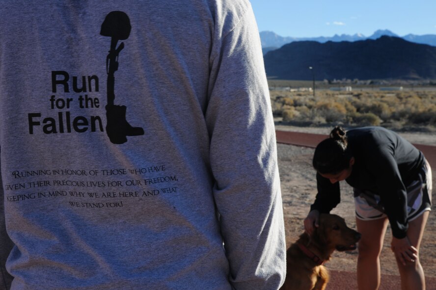 CREECH AIR FORCE BASE, Nev. - Airmen with the Creech AFB Fallen Warriors Memorial Club cool down after a two-mile run during their weekly training session Jan. 30. The club hosts runs to build endurance and speed and to help members prepare for their AF fitness assessment. (U.S. Air Force photo by Staff Sgt. Nadine/RELEASED)