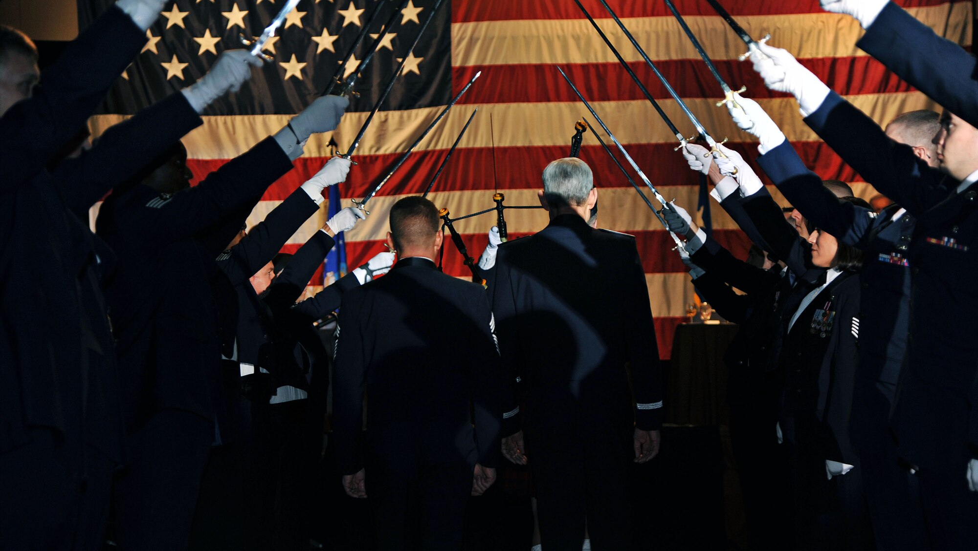 Gen. (Ret.) Norton Schwartz, the 19th Chief of Staff of the Air Force and Chief Master Sgt. William Turner, command chief of Air Force Special Operations Command, walks through a saber cordon during an Air Force Special Operations Command Order of the Sword ceremony at the Emerald Coast Convention Center on Okaloosa Island, Fla., Feb. 1, 2013. The Order of the Sword is an honor awarded by Airmen of a command to recognize individuals they hold in high esteem and for their contributions to the enlisted corps. (U.S. Air Force photo/Senior Airman Desiree Whitney Moyé)