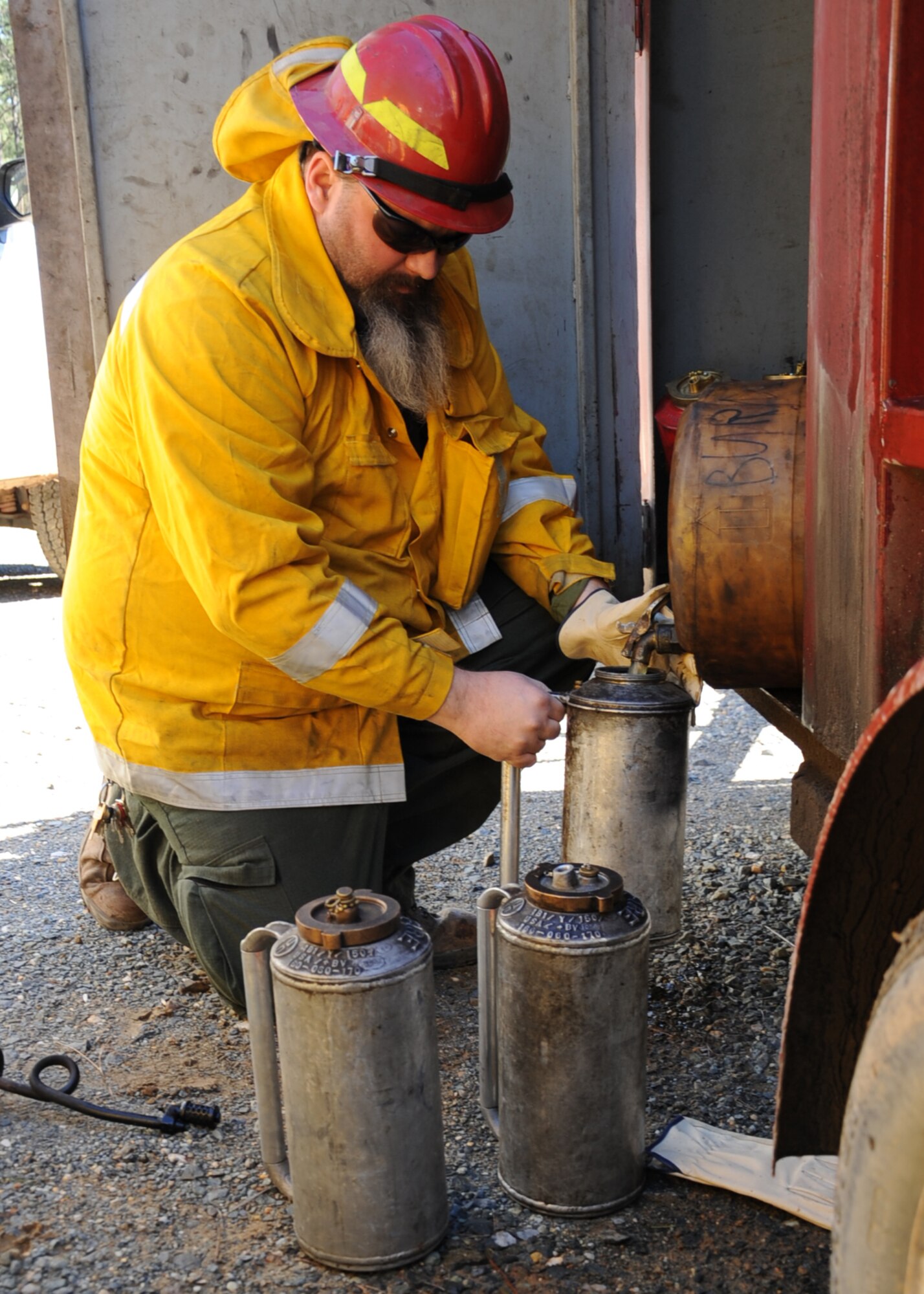 Matthew Stroupe, 2nd Civil Engineer Squadron forester, fills up gas cans that will be used during a prescribed burn on Barksdale Air Force Base, La., Jan. 31. The burn was performed over 300 acres on the East Reservation. (U.S. Air Force photo/Senior Airman Sean Martin)