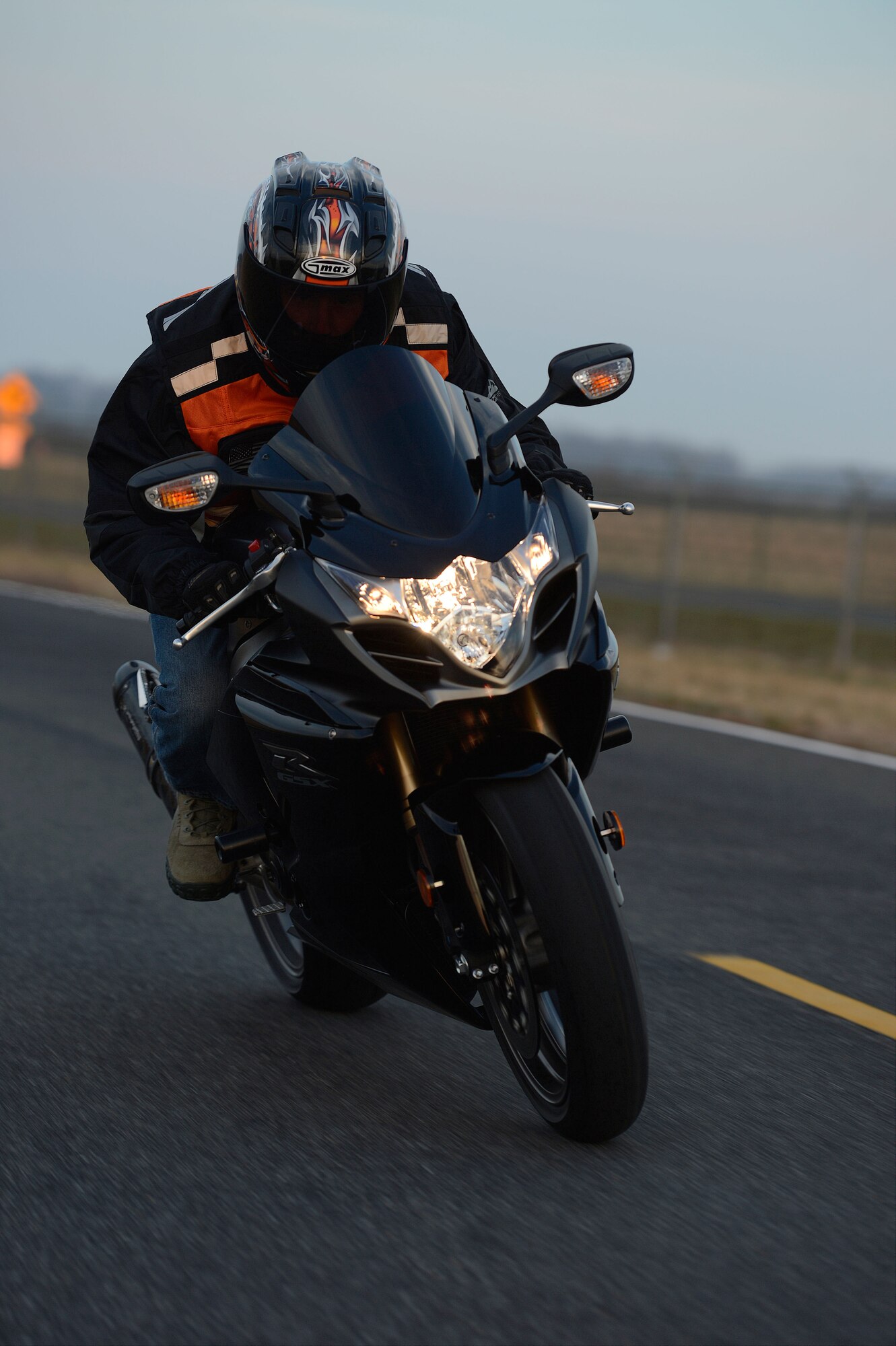 United States Air Force Senior Airman Justin Lewis rides his black 2011 Suzuki GSXR, 1000cc motorcycle on Jan. 29, 2013 at Dover Air Force Base, Del. Lewis is a member of the 436th Operational Support Squadron at Dover. Air Force members ride safely at Dover Air Force Base, Del. USAF photo/Greg L. Davis