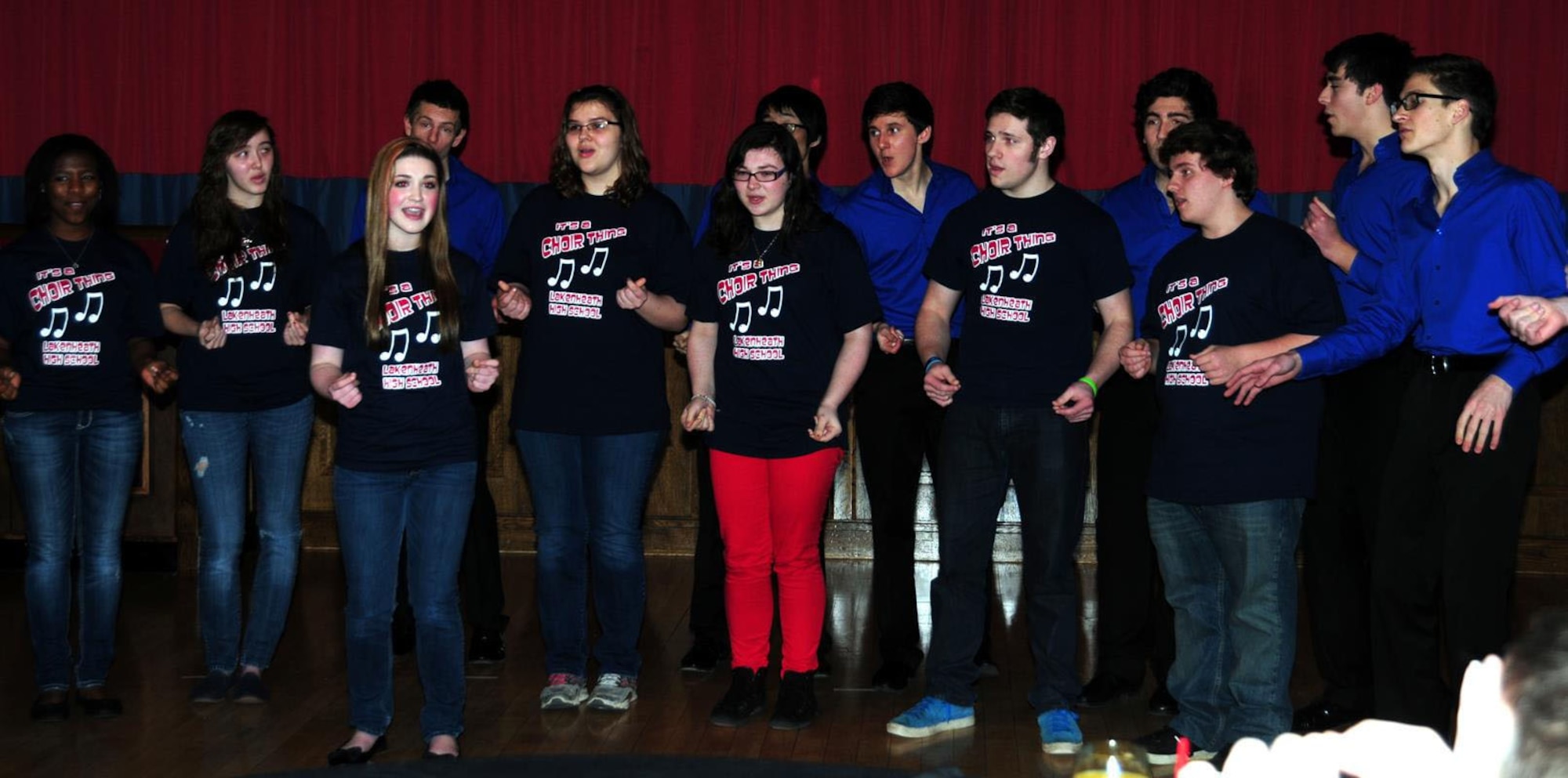 Students from Lakenheath High School choir, RAF Lakenheath, sing "The Lion Sleeps Tonight" with English acapella collegiate group "All the King's Men" Feb. 3, 2013, at the Galaxy Club on RAF Mildenhall, England. The acapella group sang a wide variety of songs including “Pay Phone,” “Call Me Maybe,” “In the Still of the Night,” “Africa” and “Skyfall.” (U.S. Air Force photo by Karen Abeyasekere/Released)
