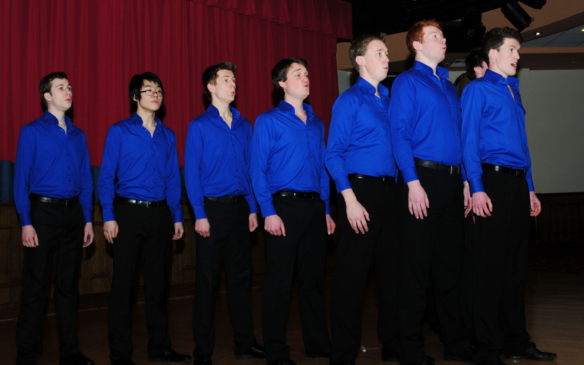 Members of “All the King’s Men,” an acapella collegiate group from King’s College, London, entertain RAF Mildenhall members and their families Feb. 3, 2013, at the Galaxy Club on RAF Mildenhall, England. The English group performed a wide variety of songs including “Africa,” “Livin’ La Vida Loca,” “In the Still of the Night” and “Skyfall.” (U.S. Air Force photo by Karen Abeyasekere/Released)