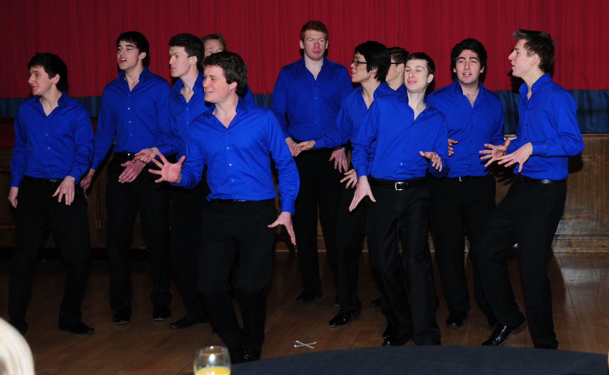 "All the King's Men," an acapella collegiate group from King's College, London, entertain RAF Mildenhall members and their families Feb. 3, 2013, at the Galaxy Club on RAF Mildenhall, England. They sang a wide variety of songs including “Pay Phone,” “Call Me Maybe,” “In the Still of the Night,” “Africa” and “Skyfall.” (U.S. Air Force photo by Karen Abeyasekere/Released)
