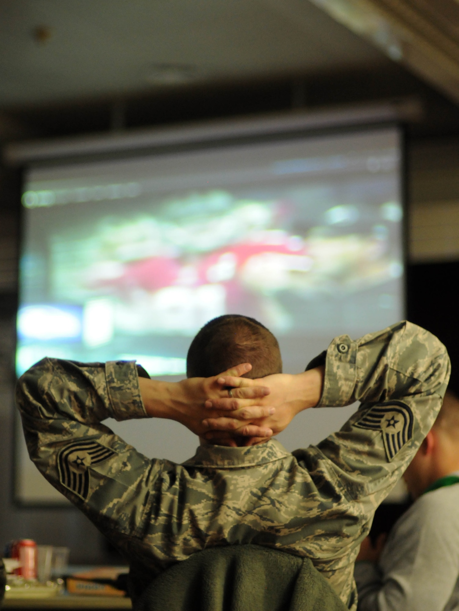 Tech. Sgt. Jason Cameron, 351st Expeditionary Air Refueling Squadron, watches the Super Bowl at a forward operating location Feb.4, 2013. Hot wings, cheese sticks, pizza and a variety of other foods were available for the big game. Members of the 351st EARS, from the 100th Air Refueling Wing, RAF Mildenhall, England, are deployed to a forward operating location in southwest Europe. The group deployed on Jan. 26 and began conducting aerial refueling missions on Jan. 27 to support French operations in Mali. (U.S. Air Force photo by Staff Sgt. Austin M. May/Released)