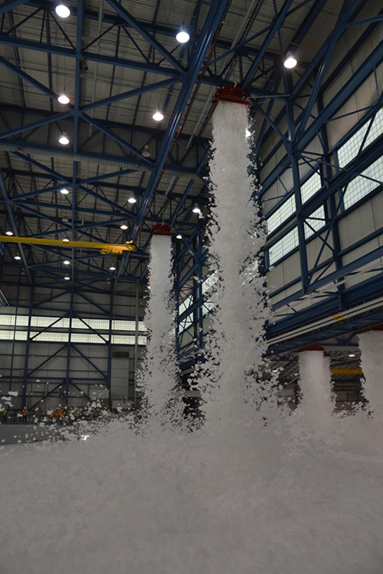 High expansion foam drops from the ceiling of the C-17 hangar during the fire protection test on March 31, 2011. The HEF expands to fill large enclosed spaces to suffocate fire.