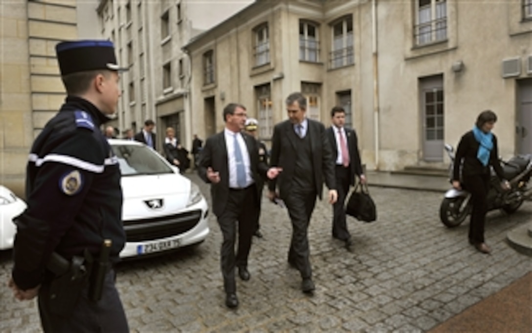 Deputy Secretary of Defense Ashton B. Carter, second from left, is escorted through the courtyard of the French Ministry of Defense by French senior political adviser Jean-Claude Mallet as they walk to a meeting in Paris, France, on Feb. 1, 2013.  Paris is the first stop of Carter’s six-day trip to meet with officials in France, Germany and Jordan.  Carter also will visit with U.S. service members to thank them for their service.  