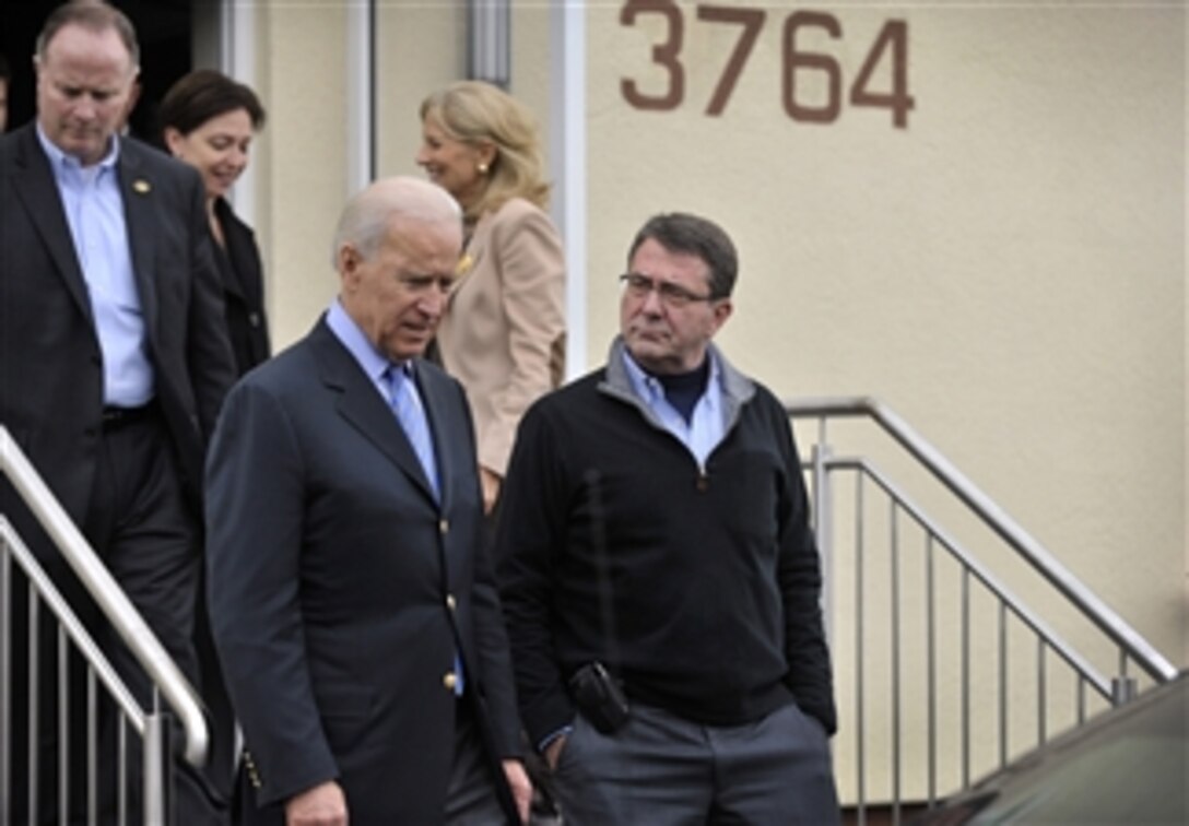 Deputy Secretary of Defense Ashton B. Carter, right, listens to Vice President Joe Biden, center, as they leave the Landstuhl Regional Medical Center in Ramstein, Germany, on Feb. 3, 2013.  Carter and Biden visited wounded warriors recovering at Landstuhl to thank them for their service.  Both Carter and Biden attended the 49th Munich Security Conference in Munich the previous day.  The conference is an annual meeting of heads of state, foreign affairs leaders and defense policy leaders from around the world.  Germany is the second stop of Carter’s six-day trip to meet with officials in France, Germany and Jordan.  
