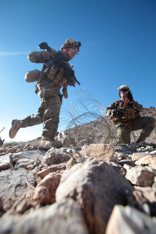 130131-M-OH054-199
(Right) Lance Cpl. Nathan Hugel, a Vacaville Calif., native and fire team leader with Bravo Company, 1st Battalion, 4th Marine Regiment, 13th Marine Expeditionary Unit, finishes clearing concertina wire as Marines push forward during company-sized assault training, as part of Exercise Iron Fist 2013, aboard Marine Corps Air Ground Combat Center Twentynine Palms, Calif. Jan. 31, 2013. During Iron Fist 2013, 13th MEU, and Japan Ground Self Defense Force will spend three weeks participating in bilateral training to improve their interoperability, enhance military-to-military relations and sharpen skills essential to crisis response. (U.S. Marine Corps photo by Sgt. Christopher O’Quin/Released)
