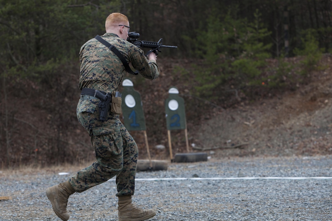 Lance Cpl. Kyle Ruud, second platoon, Guard Company, Marine Barracks Washington, D.C., shoots an M4 carbine during a training exercise at Marine Corps Base Quantico, Va., Jan. 30. The Marines conduct monthly, advanced CMP live-fire exercises in Quantico.  The training evolutions maintain their high levels of proficiency with the M4 carbine, M9 handgun and M1014 shotgun.  The Guard Marines fire on the move while engaging multiple targets, and utilize stress drills to sharpen their tactics.
