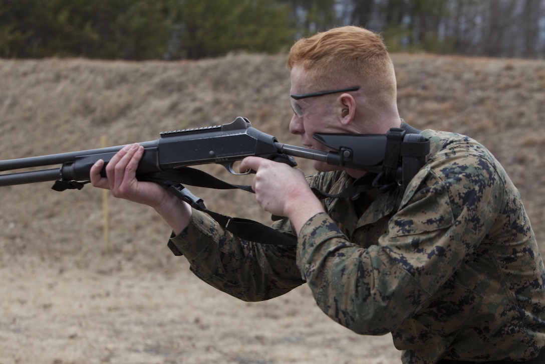 Lance Cpl. Kyle Ruud, second platoon, Guard Company, Marine Barracks Washington, D.C., shoots an M1014 shotgun during a training exercise at Marine Corps Base Quantico, Va., Jan. 30. The Marines conduct monthly, advanced CMP live-fire exercises in Quantico.  The training evolutions maintain their high levels of proficiency with the M4 carbine, M9 handgun and M1014 shotgun.  The Guard Marines fire on the move while engaging multiple targets, and utilize stress drills to sharpen their tactics.