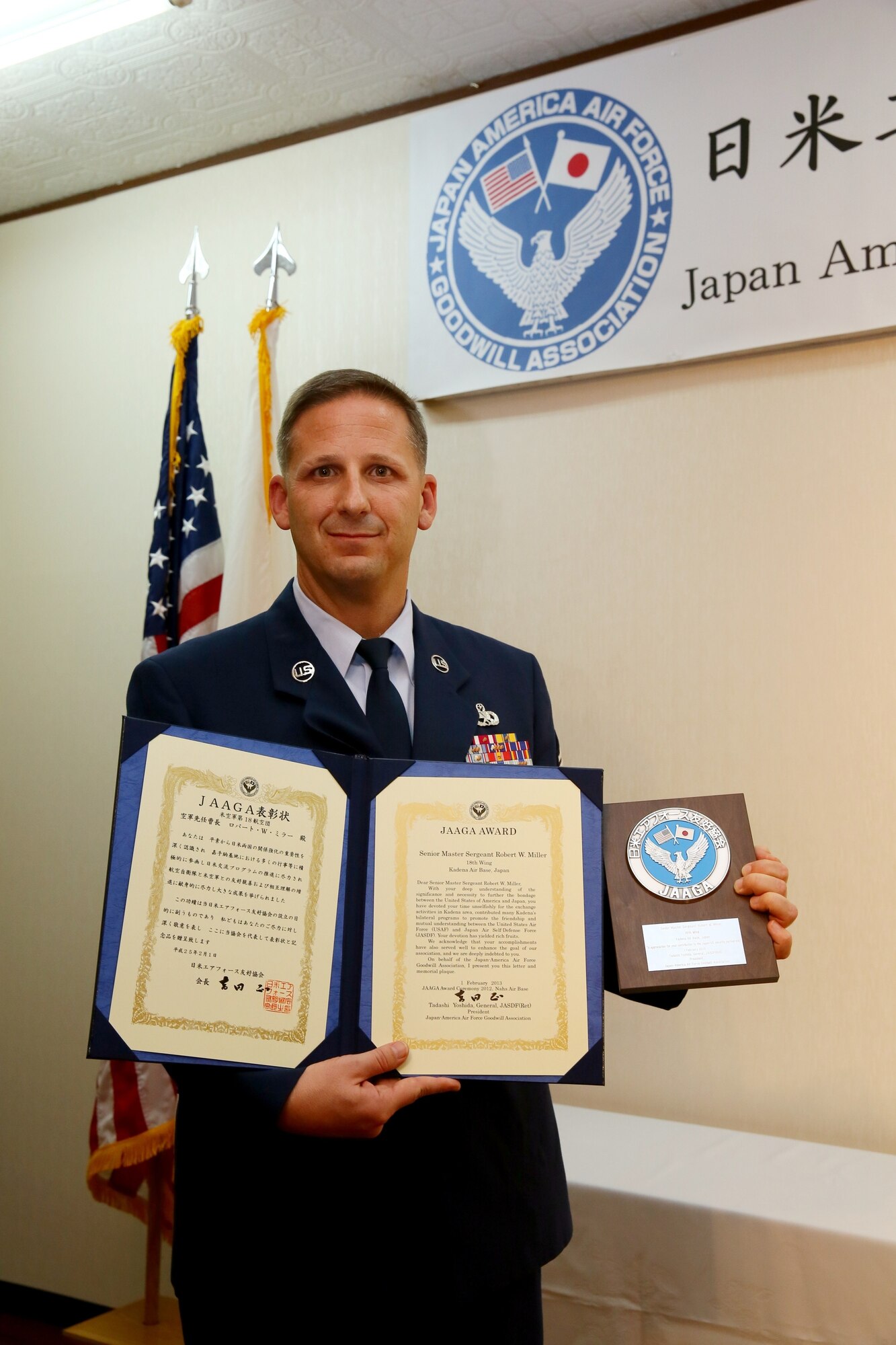 U.S. Air Force Senior Master Sgt. Robert Miller, from the 718th Aircraft Maintenance Squadron, is recognized during the 15th annual Japan-America Air Force Goodwill Association award ceremony and reception at Naha Air Base, Japan, Feb. 1, 2013. Miller and Japan Air Self Defense Force Master Sgt. Hisashi Saiki were recognized at the event for their work to strengthen the bonds between the U.S. and Japan. (Japan Air Self Defense Force photo/Chief Master Sgt. Tatsuya Hosobuchi)
