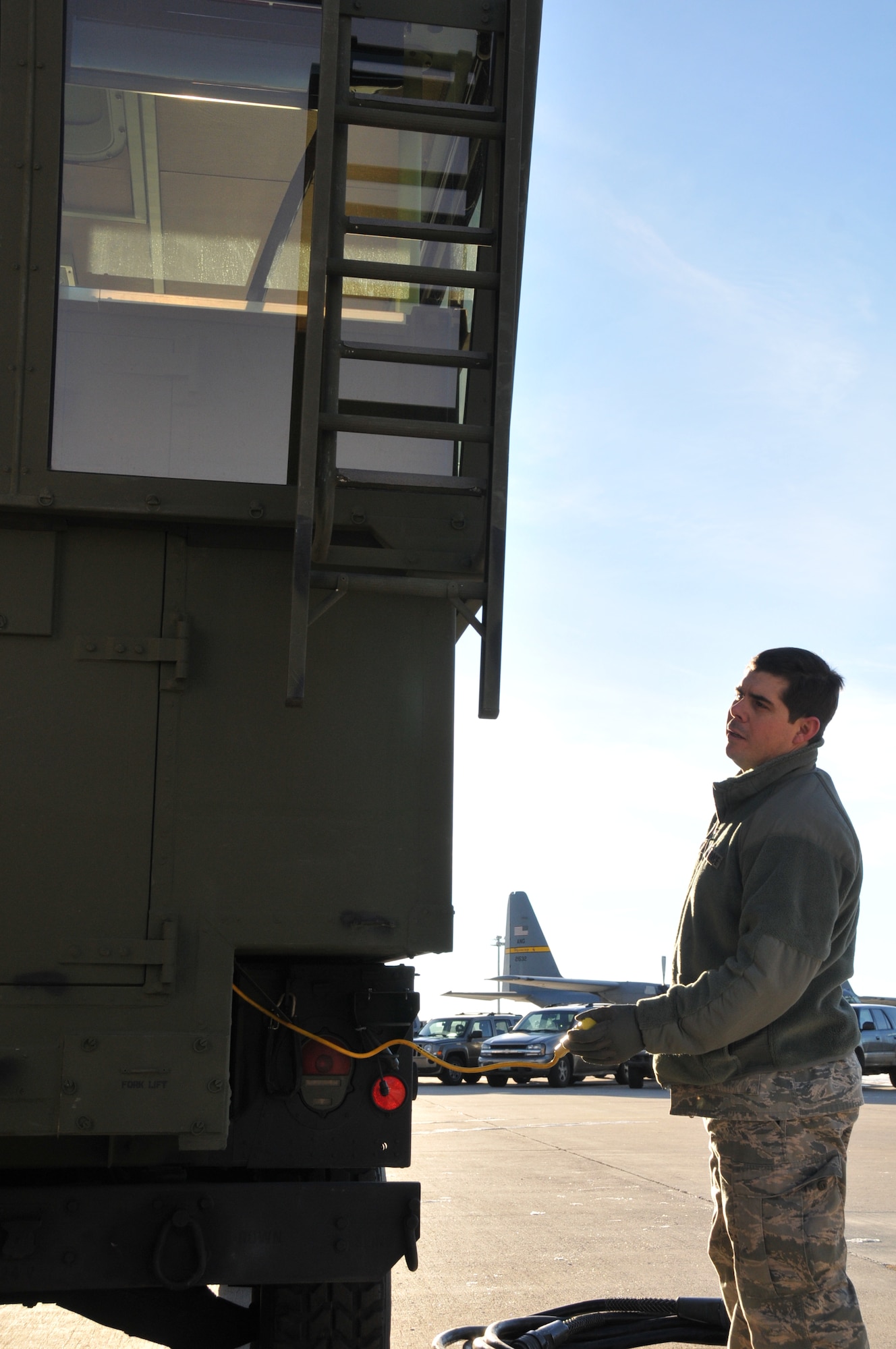 Senior Airman Eric Henning, 243rd Air Traffic Control Squadron, sets up the tactical air navigation aide Jan. 6, 2013. (U.S. Air Force photo by Tech. Sgt. Natalie Stanley)