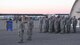 Airmen of the 377th Logistics Readiness Squadron conduct a reveille formation Jan. 31 outside the unit’s vehicle maintenance building. The 377 LRS conducts the event each month to help reinforce military heritage.