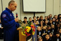 Lt. Col. Dwight Peake speaks about Lt. Col. Michael Anderson during an assembly held at the Michael Anderson Elementary School at Fairchild Air Force Base, Wash., Jan. 31, 2013. Peake, 92nd Aerospace Medicine Squadron commander, served with Anderson, a KC-135 Stratotanker pilot and NASA astronaut, during an assignment.  (U.S. Air Force photo by Airman 1st Class Janelle Patiño)
