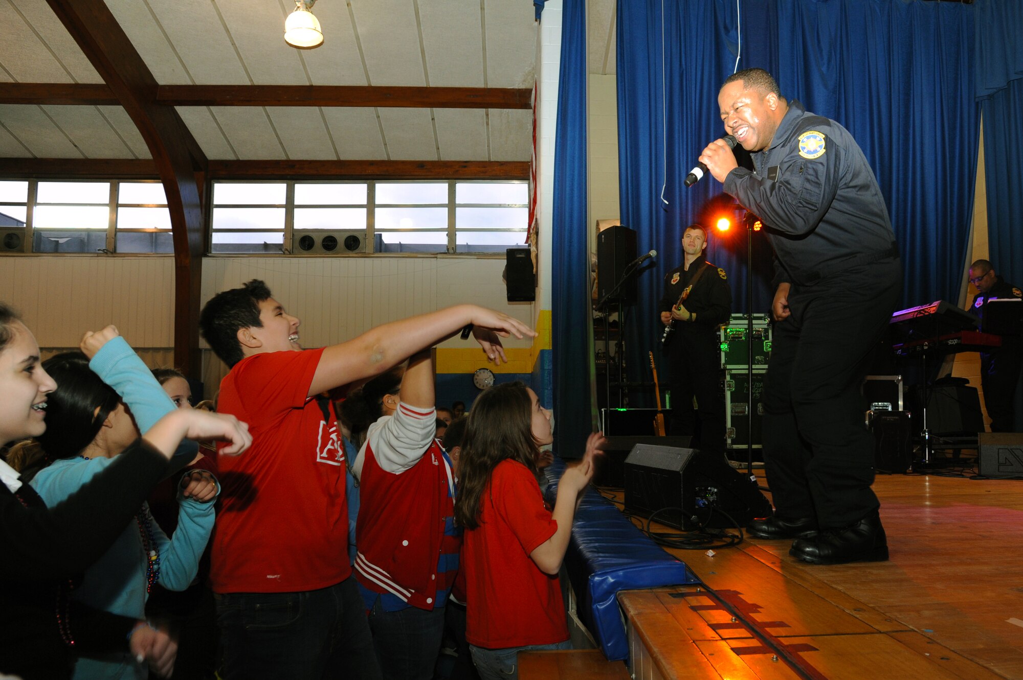 U.S. Air Force Heritage band “The Blue Aces” plays for childern of the Our Lady of Mount Carmel School at Newport News, Va., Jan. 28, 2013 Students were celebrating parents day at the school along with National Catholic Education Week. (U.S. Air Force photo by Airman First Class Victoria Taylor/ Released)