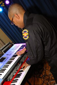 U.S. Air Force Master Sgt Craig Stevens, keyboardist for the Heritage band “The Blue Aces”, plays for the students of Our Lady of Mount Carmel Catholic School at Newport News, Va., Jan. 28, 2013. Many of the events run at OLMC are volunteer driven through parents and faculty. (U.S. Air Force photo by Airman First Class Victoria Taylor/ Released)