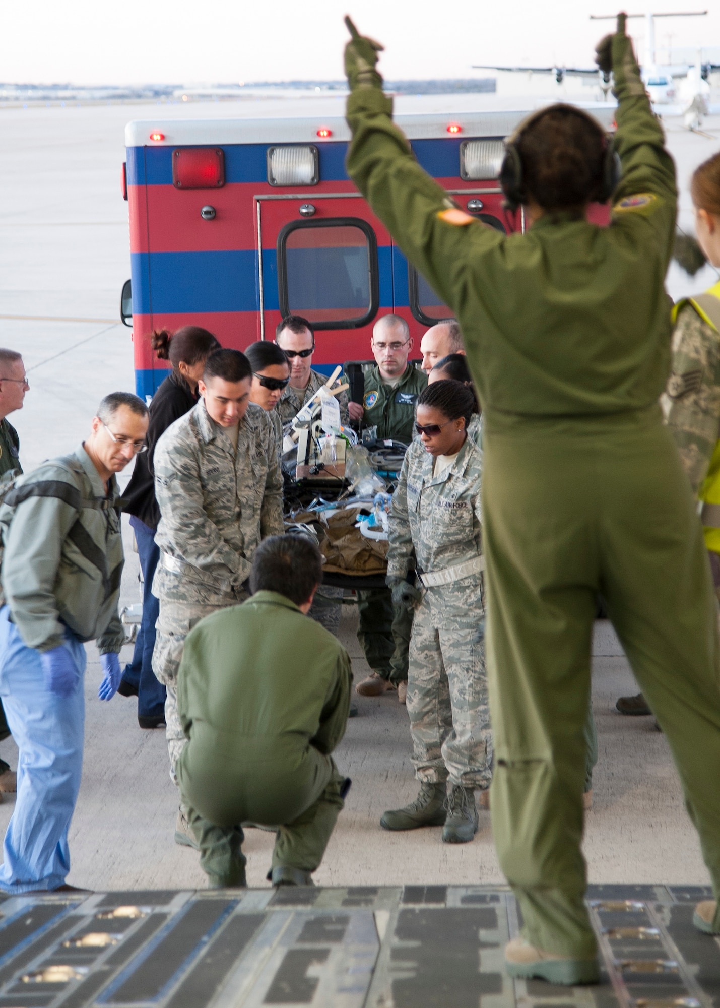 Members of the 59th Medical Wing Aeromedical Staging Facility transfer a patient being treated with an extracorporeal membrane oxygenation system into a C-17 Globemaster III, Jan. 16 at Joint Base San Antonio-Lackland, Texas. ECMO is a heart-lung bypass system that circulates blood through an external artificial lung and sends it back into the patient’s bloodstream. (U.S. Air Force photo/Staff Sgt. Kevin Iinuma)