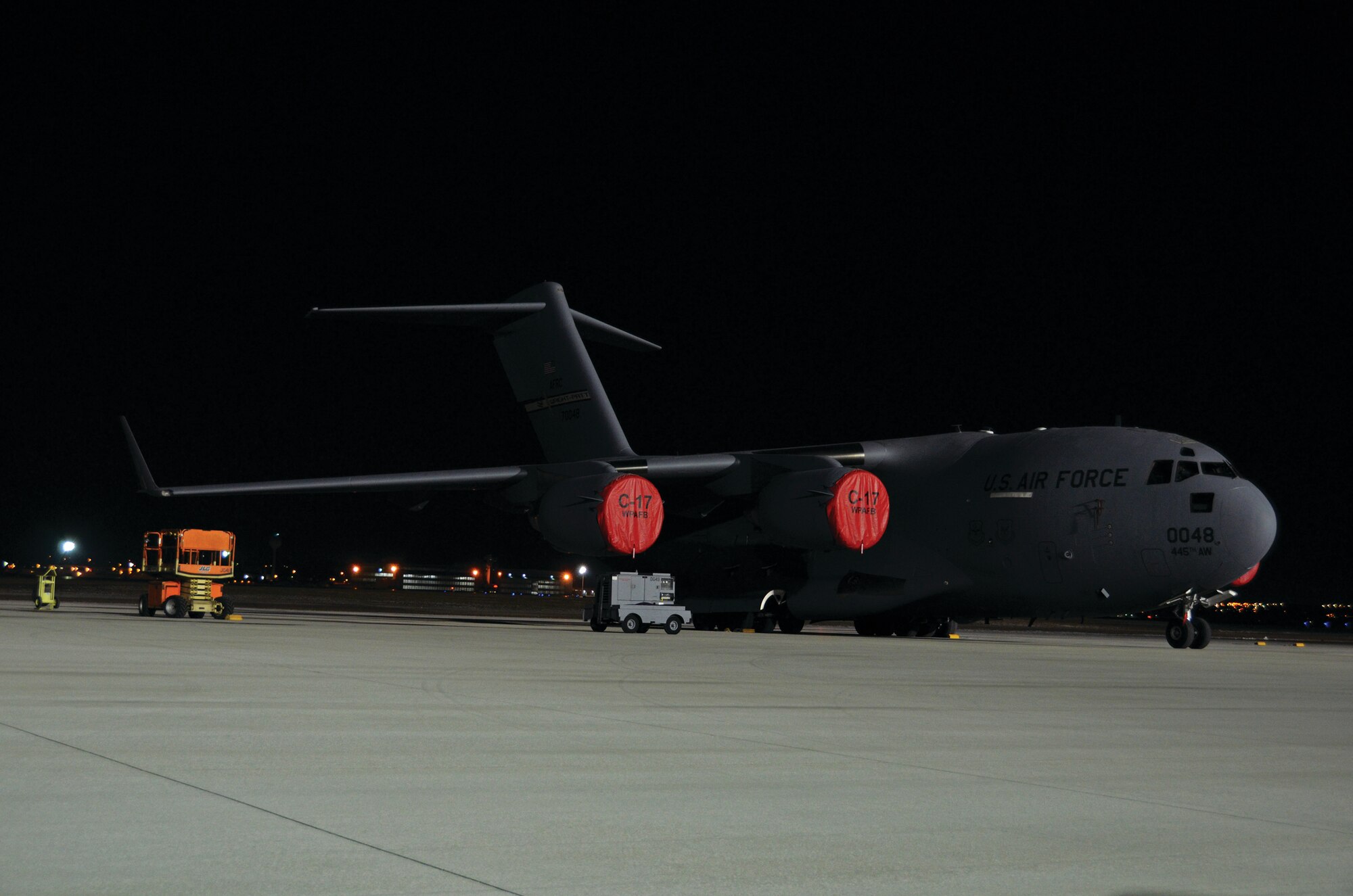 WRIGHT-PATTERSON AIR FORCE BASE, Ohio - Night fall brings out the beauty of a 445th Airlift Wing C-17 Globemaster III as it sits on the ramp at Wright-Patterson Air Force Base, Ohio. The wing’s latest asset is capable of rapid strategic delivery of troops and all types of cargo to main operating bases or directly to forward bases in the deployment area. (U.S. Air Force photo/Staff Sgt. Mikhail Berlin)