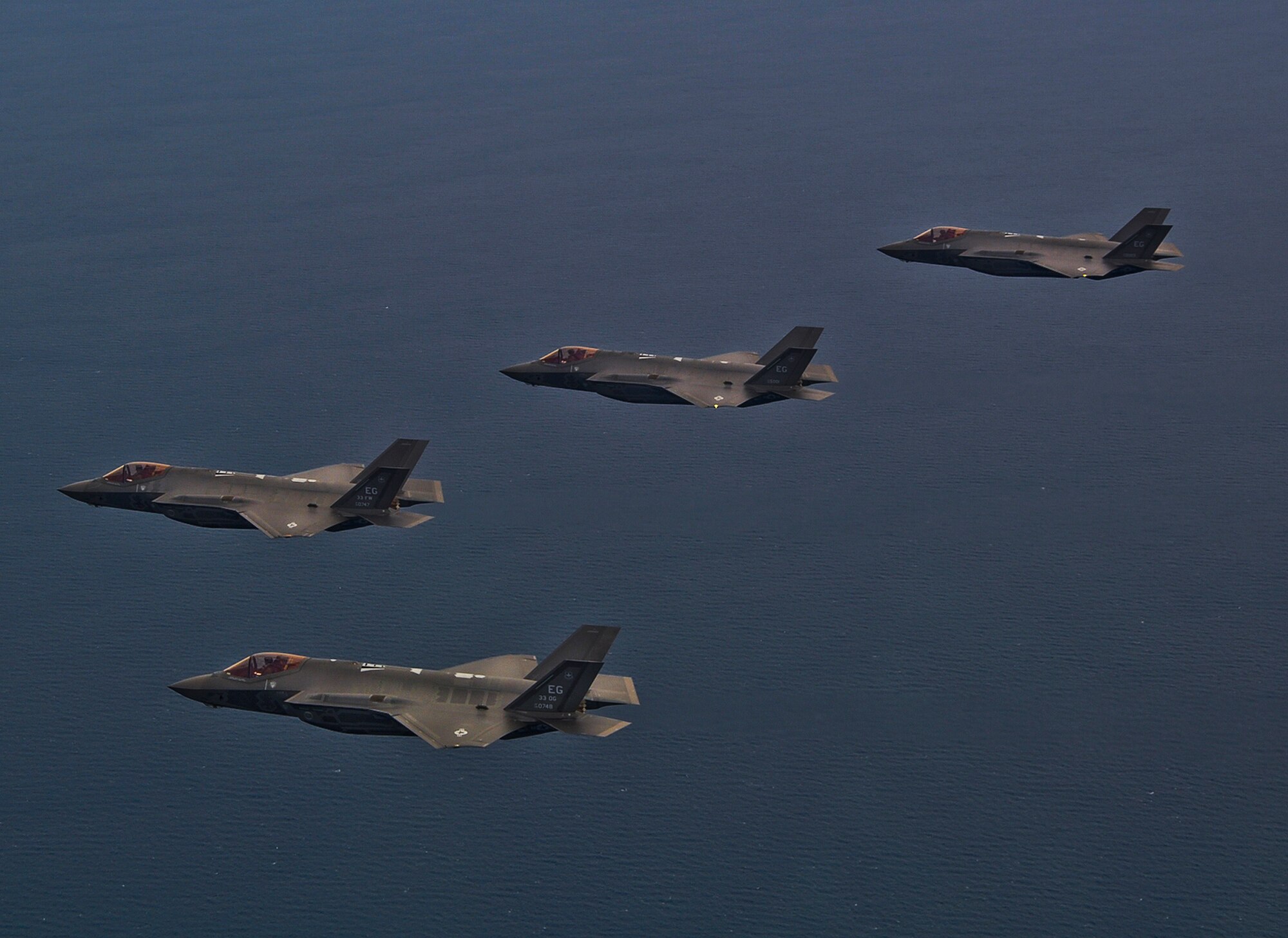 A four-ship of F-35A Lightning IIs flies over the Gulf of Mexico Feb. 1 before returning to Eglin Air Force Base, Fla.  Pilots with the 33rd Fighter Wing began flying the formation the first time here last week.  (U.S. Air Force photo/Capt. Edward Schmitt)